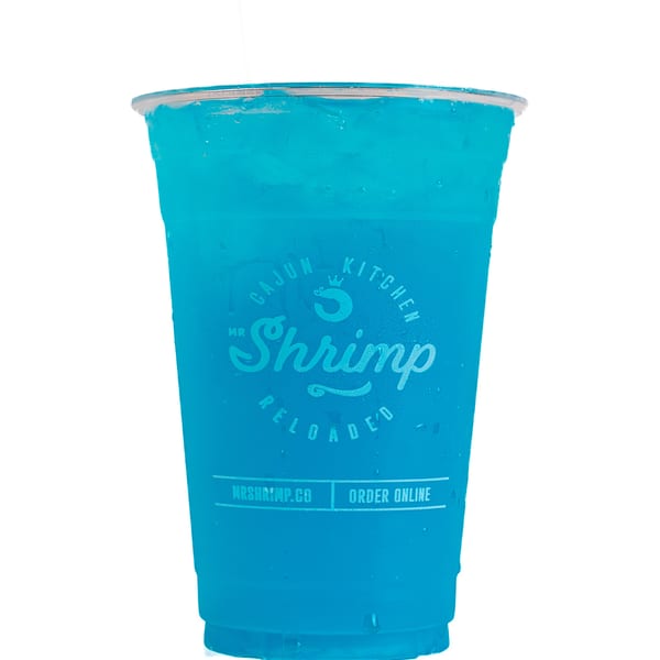 Bright blue iced beverage in a clear Mr Shrimp Cajun Kitchen branded plastic cup against a white background.